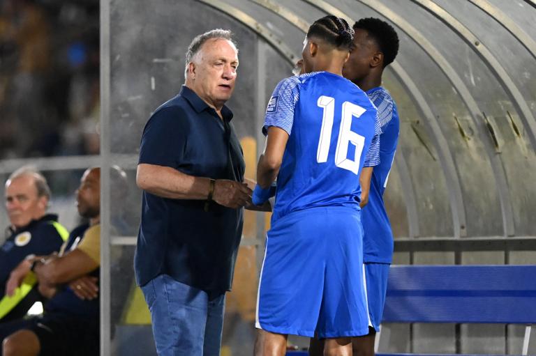 WILLEMSTAD - Curacao coach Dick Advocaat gives instructions to Jearl Margaritha of Curacao and Kevin Felida of Curacao during the World Cup qualifying Concacaf match between Curacao and Barbados at the Ergilio Hato stadium on June 5, 2024 (local time) in Willemstad, Curacao. ANP | Hollandse Hoogte | GERRIT VAN COLOGNE (Photo by ANP via Getty Images)