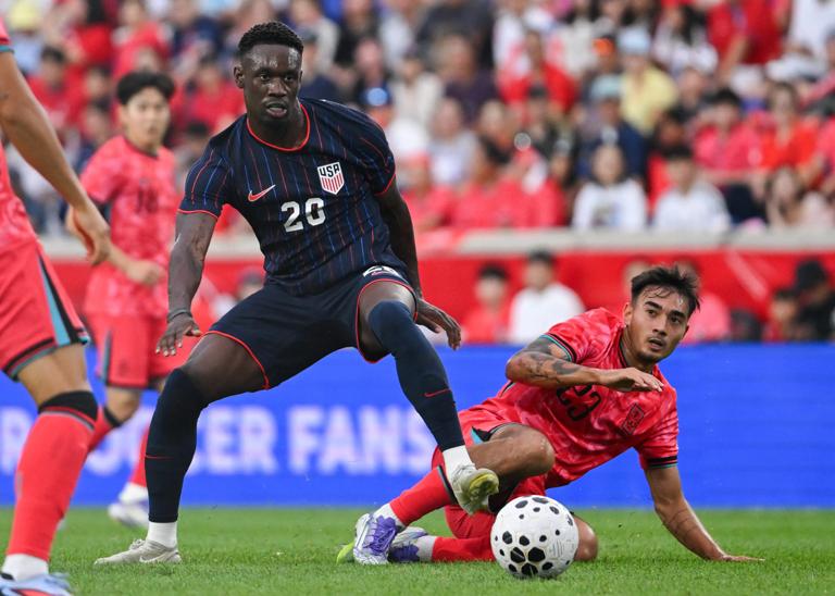 HARRISON, NEW JERSEY - SEPTEMBER 06: Folarin Balogun #20 of the United States gets past a fallen Jens Castrop #23 of the Korea Republic during the second half of an International Friendly at Sports Illustrated Stadium on September 06, 2025 in Harrison, New Jersey. (Photo by Howard Smith/ISI Photos/USSF/Getty Images)