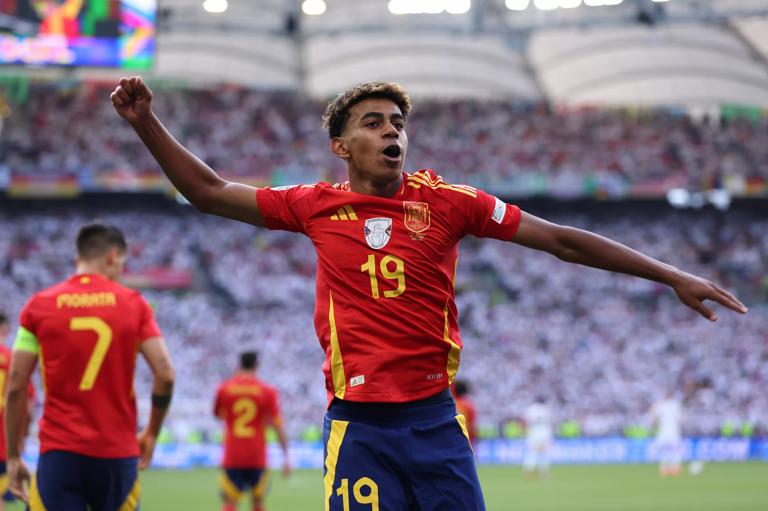 STUTTGART, GERMANY - JULY 05: Lamine Yamal of Spain celebrates after teammate Dani Olmo (not pictured) scores his team's first goal during the UEFA EURO 2024 quarter-final match between Spain and Germany at Stuttgart Arena on July 05, 2024 in Stuttgart, Germany. (Photo by Alex Livesey/Getty Images)