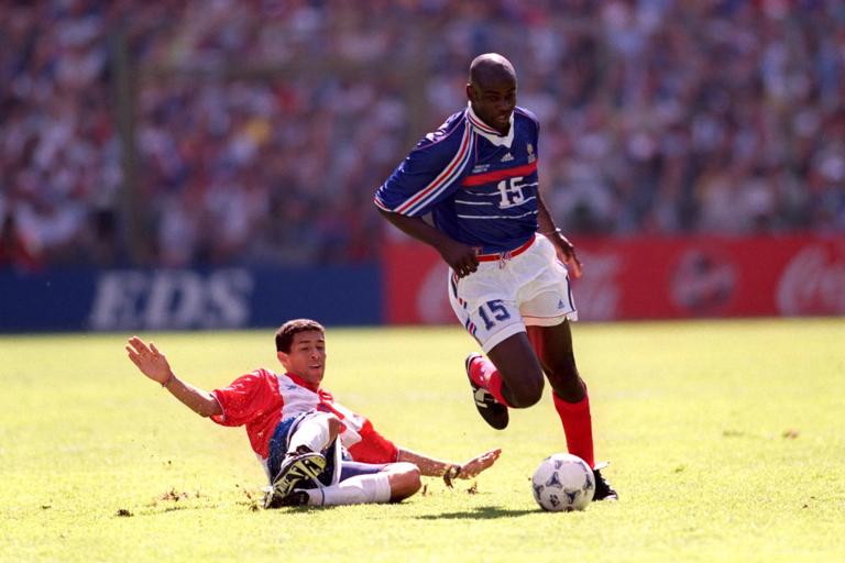 France's Lilian Thuram (right) gets away from the tackle of Paraguay's Jorge Campos  (left)  (Photo by Michael Steele/EMPICS via Getty Images)
