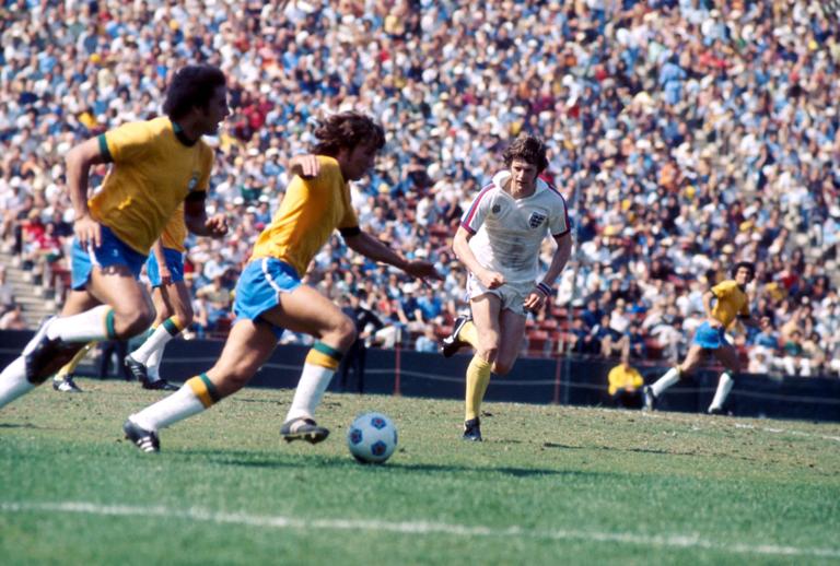England's Mick Channon (r) sprints across to try to thwart a Brazil attack (Photo by Peter Robinson/EMPICS via Getty Images)